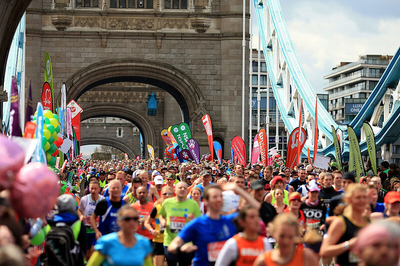 Runners make their way across Tower Bridge during the Virgin Money London Marathon on Saturday in London. Runners make their way across Tower Bridge during the Virgin Money London Marathon on Saturday in London.