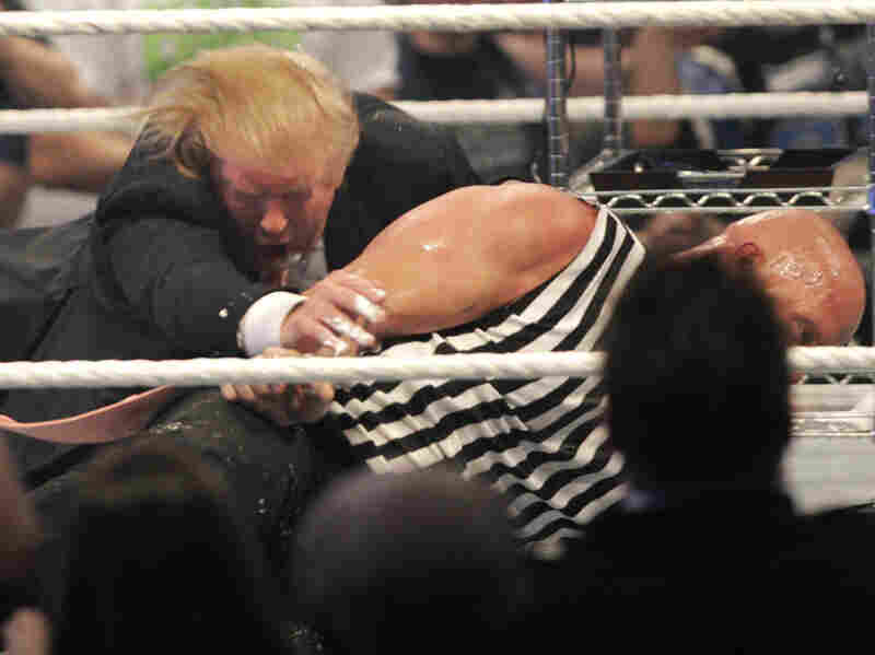 Donald Trump wrestling with 'Stone Cold' Steve Austin after the the Battle of the Billionaires at the 2007 World Wrestling Entertainment's Wrestlemania April 1, 2007.