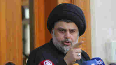 Shiite cleric Muqtada al-Sadr speaks in Najaf, Iraq, on Saturday. His supporters entered Baghdad's heavily fortified Green Zone and parliament the same day.