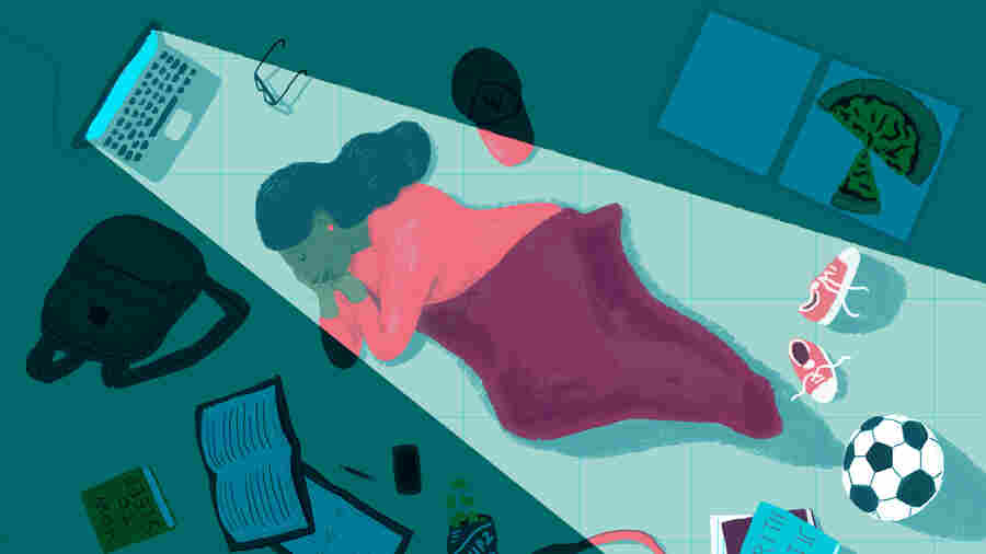 College student sleeping on dorm room floor