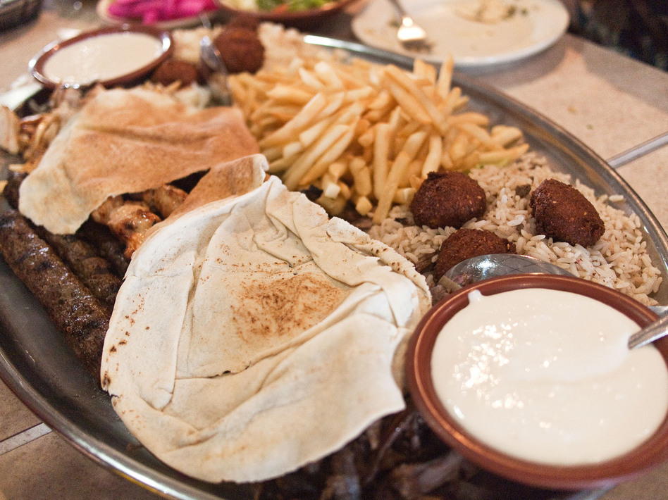A platter of falafel, kafta, french fries and other fare at Al Ameer Restaurant in Dearborn, Mich. The Mediterranean eatery will be recognized by the James Beard Awards this year in the "American Classics" category. (Edsel Little/Flickr)