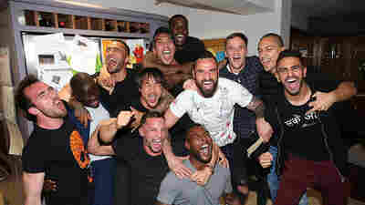 Leicester City players who had gathered at Jamie Vardy's house to watch title rivals Tottenham, play Chelsea, celebrate after clinching the trophy.