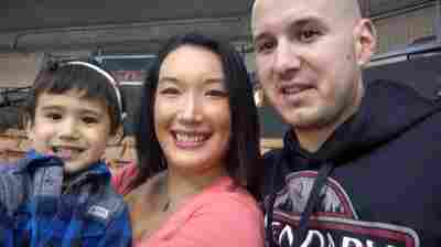 Nancy Glynn, her husband Michael Gebo and their son, Hunter, attend a minor league baseball game near their home in Manchester, N.H.