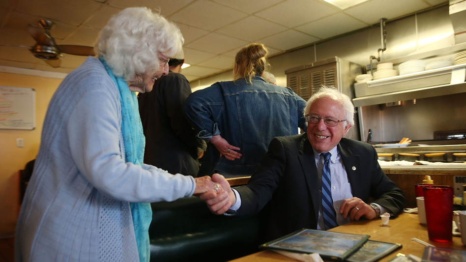 Madonna Rea shakes hands with Democratic presidential candidate Bernie Sanders as he has breakfast at Peppy Grill on Tuesday in Indianapolis. (Joe Raedle/Getty Images)