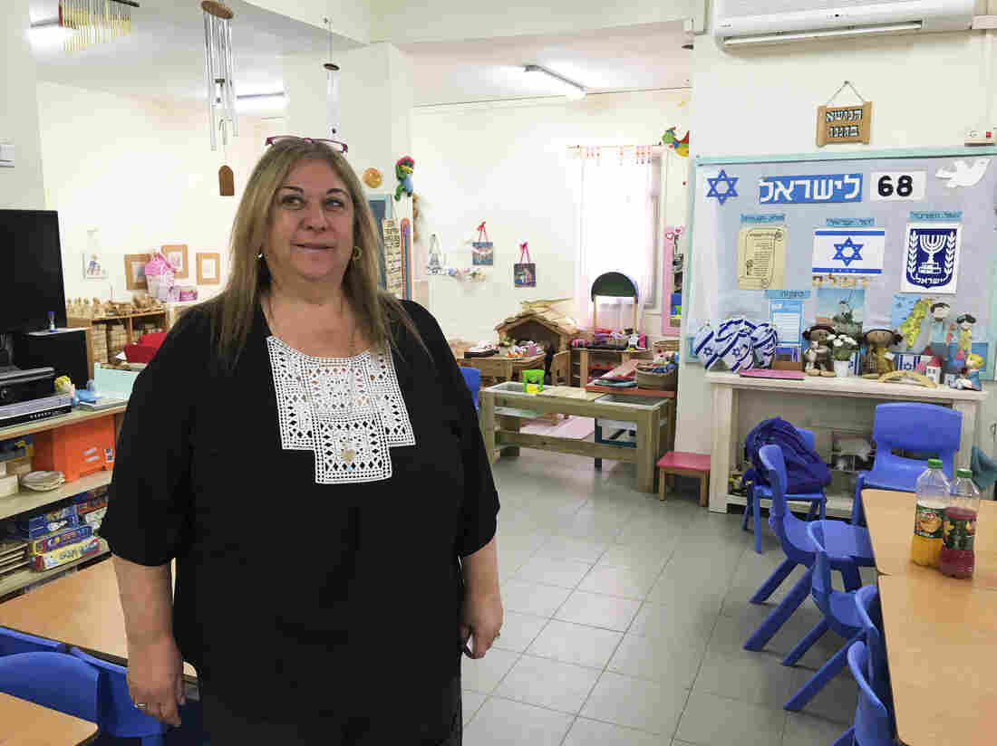Kindergarten teacher Nava Ron says she's always explained a little bit about Holocaust Remembrance Day to help her students understand what is happening around them. She tells children it was part of a war a long time ago and far away, and she focuses on themes of tolerance and heroism. Kindergarten teacher Nava Ron says she's always explained a little bit about Holocaust Remembrance Day to help her students understand what is happening around them. She tells children it was part of a war a long time ago and far away, and she focuses on themes of tolerance and heroism.
