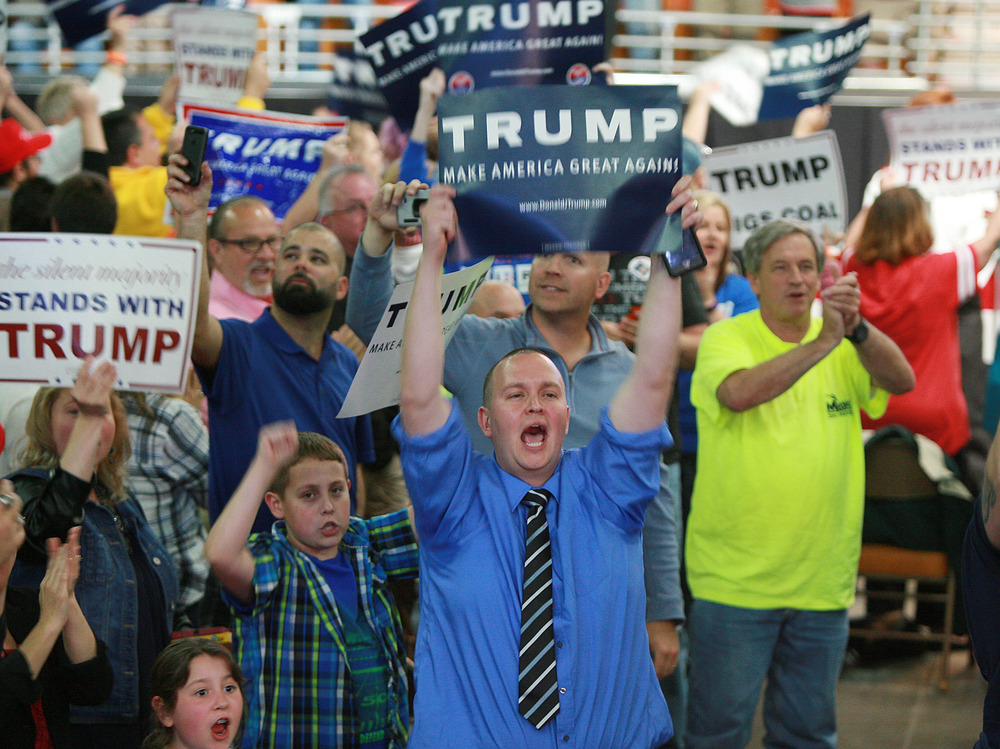 Supporters of Republican presidential candidate Donald Trump shout at the media prior to a rally at the Charleston Civic Center on May 5 in Charleston, W.Va.