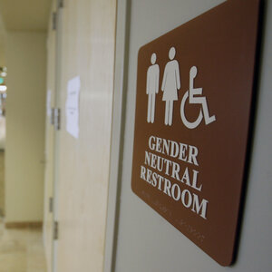 A sign marks the entrance to a gender-neutral restroom at the University of Vermont in Burlington, Vt.