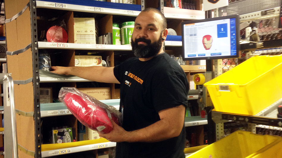 Warehouse employee Rejinaldo Rosales, 34, at work in Tracy, Calif. (Brandon Bailey/AP)