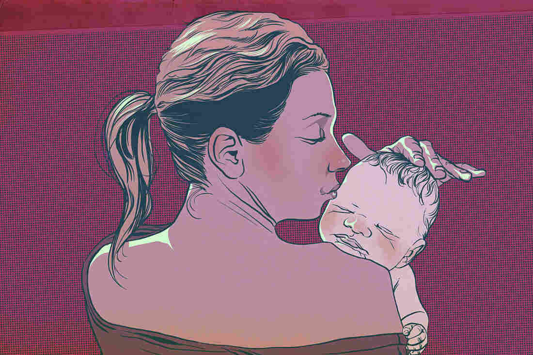Mother caresses her newborn baby