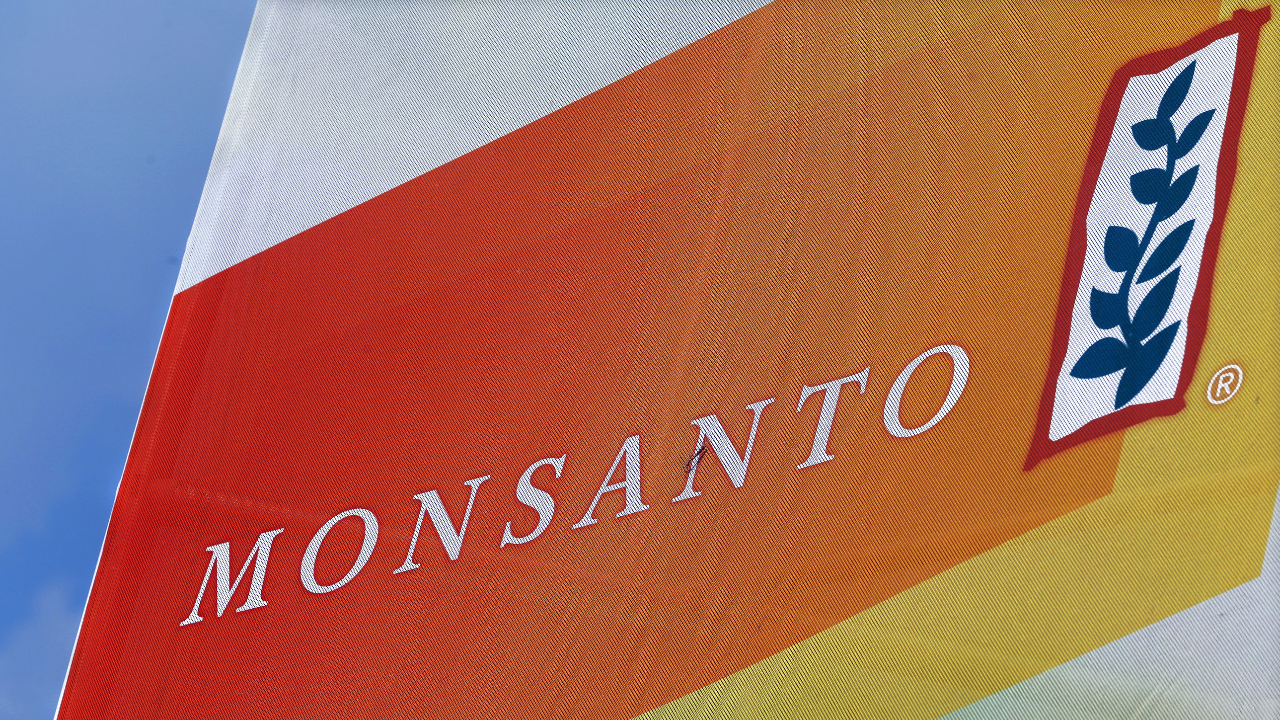 The Monsanto logo is seen at the Farm Progress Show in Decatur, Ill., last year. German drug and chemicals company Bayer AG confirmed Thursday that it has entered talks to buy Monsanto. (AP)