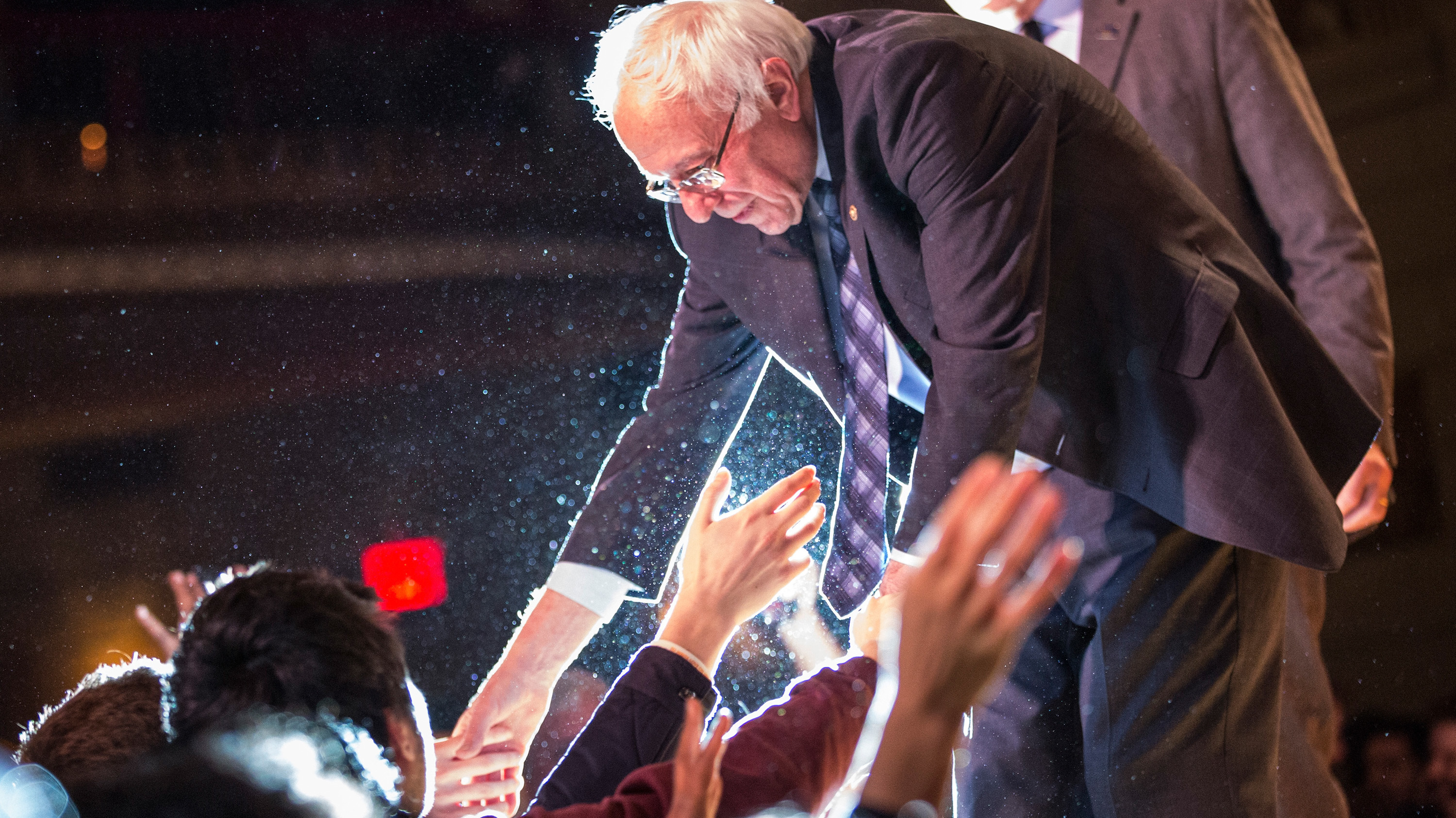 Democratic presidential candidate Bernie Sanders shakes hands with supporters in January in New York City.