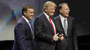 Donald Trump is introduced by National Rifle Association executive director Chris Cox (left) and NRA executive vice president Wayne LaPierre on Friday at the organization's convention in Louisville, Ky.