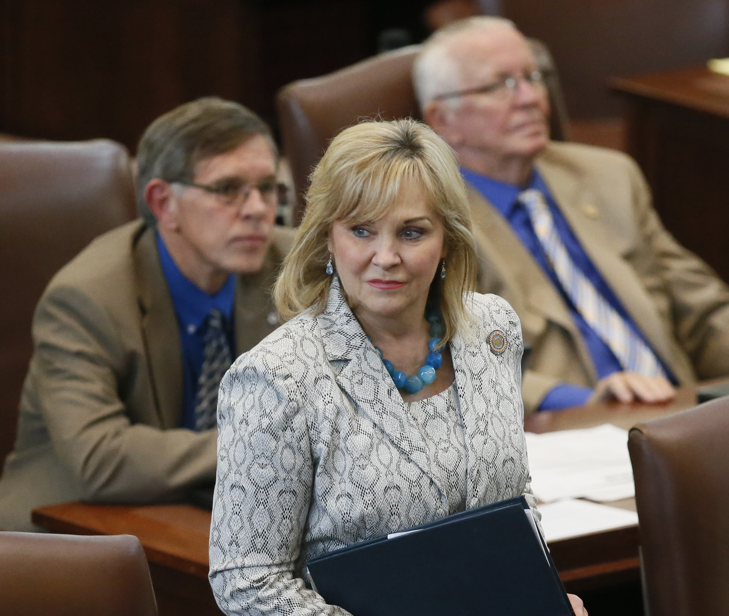 Oklahoma Gov. Mary Fallin walks on the floor of the Oklahoma House on Wednesday. On Friday, Fallin vetoed legislation that would make it a felony for doctors to perform an abortion.