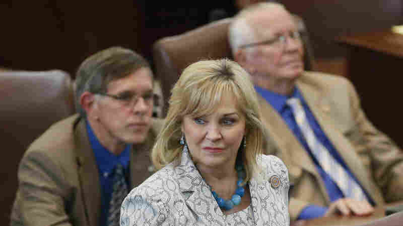Oklahoma Gov. Mary Fallin walks on the floor of the Oklahoma House on Wednesday. On Friday, Fallin vetoed legislation that would make it a felony for doctors to perform an abortion.