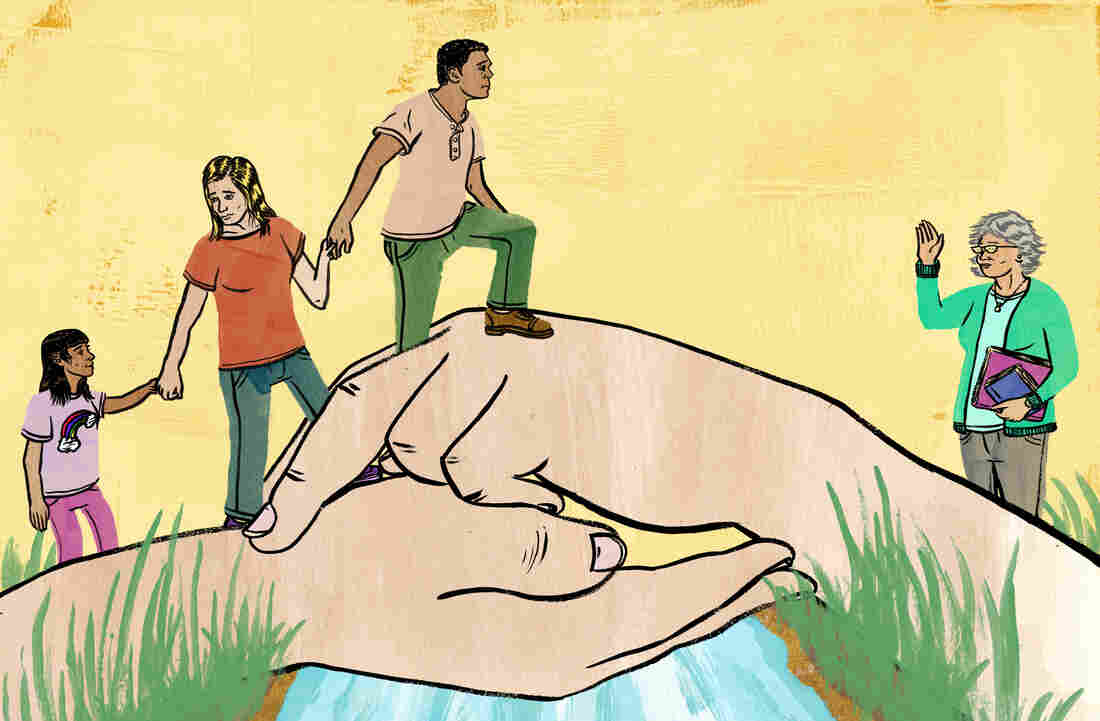 Parents lead their daughter across a bridge
