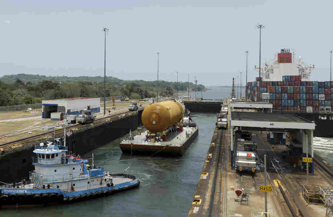 The tugboat and barge transporting NASA's only remaining space shuttle external tank, makes it through the Gatun locks of the Panama Canal, Panama, in April.