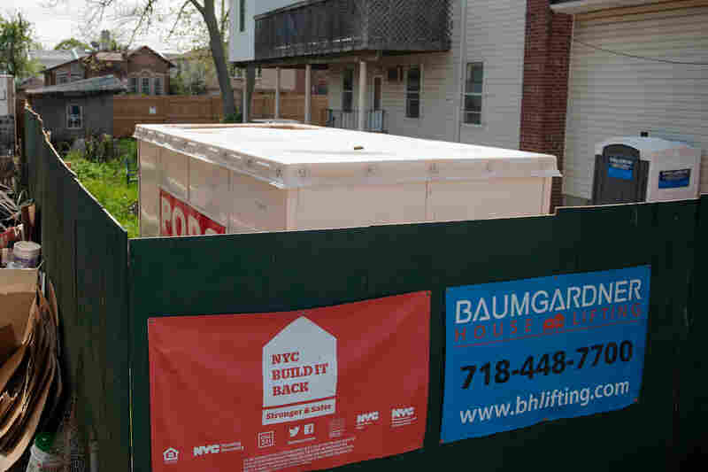 A sign for the Build It Back program hangs on the plywood fence of a construction site on Staten Island, N.Y. A sign for the Build It Back program hangs on the plywood fence of a construction site on Staten Island, N.Y.