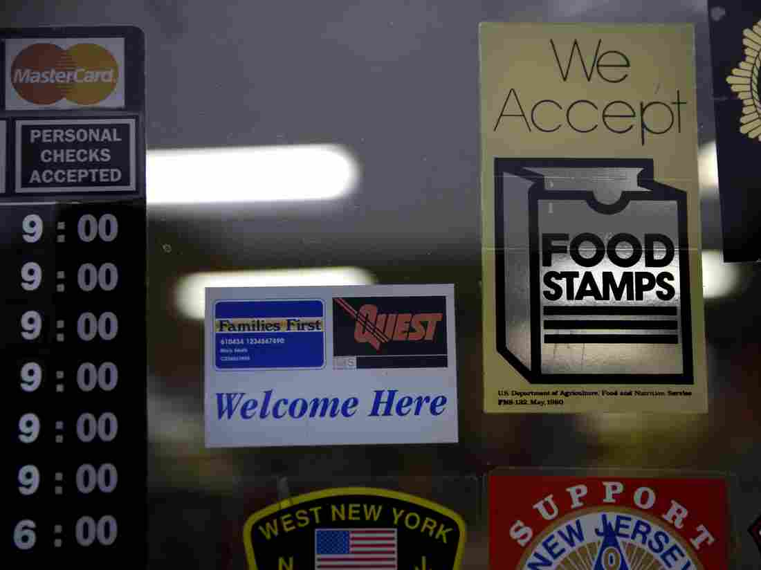 A supermarket displays stickers indicating they accept food stamps in West New York, N.J. (AP Photo/Seth Wenig)
