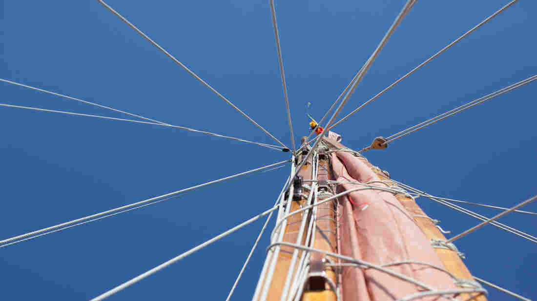 The mast must come down in the next part of the journey to get past the bridges on the Potomac River on the way to the Washington, D.C., stop. The lei at the very top is color coded; traditionally each captain had his own color so the boats could recognize who was on it from afar.