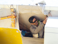 Behind the canvas on both sides of the boat are the small, 6-foot 