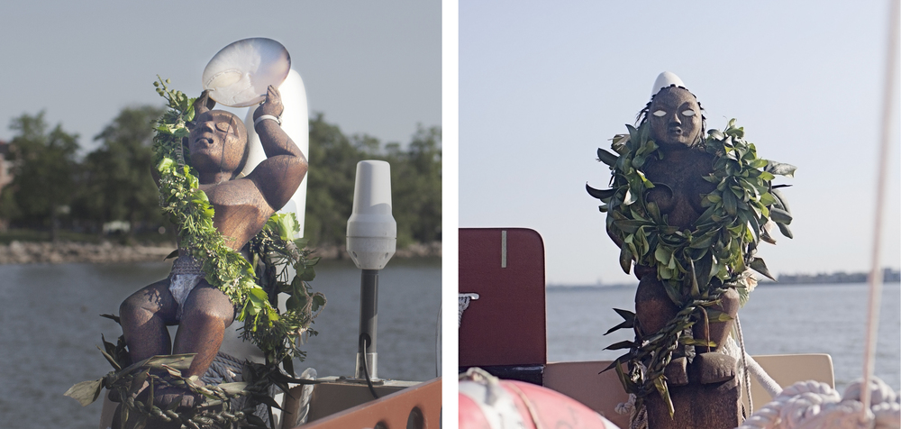 Ki'i, statues that help guide the vessel, are on either side of the boat. Only the female (right) has eyes because she sees the way while the male counterpart stands guard.
