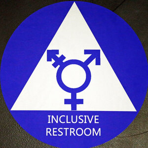 A new sticker designates a gender neutral bathroom at a high school in Seattle. President Obama's directive ordering schools to accommodate transgender students has been controversial in some places, leading 11 states to file a lawsuit against the Obama administration in response.
