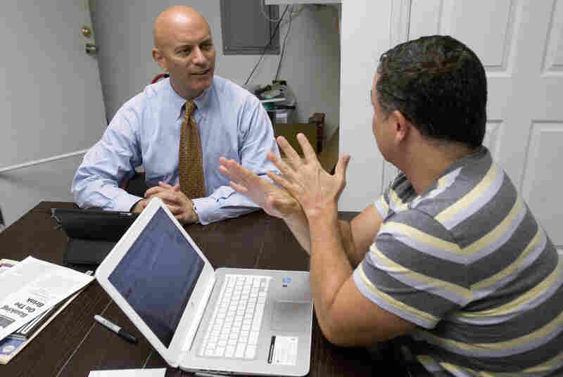 Tim Canova, left, talks with his chief of staff, Richard Bell at his campaign headquarters in Hollywood, Fla. Tim Canova, left, talks with his chief of staff, Richard Bell at his campaign headquarters in Hollywood, Fla.