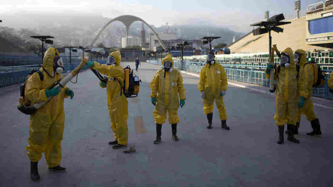 Health workers get ready to spray insecticide to combat the Aedes aegypti mosquitoes that transmits the Zika virus in January, under the bleachers of the Sambadrome in Rio de Janeiro, which will be used for the Archery competition in the 2016 summer games.