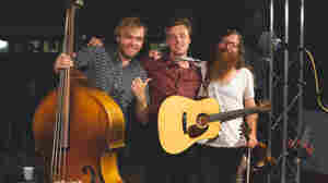 Parker Millsap (center) and bandmates Michael Rose (left) and Daniel Foulks (right) in the World Cafe performance studio.