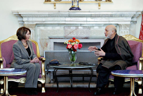 Zabihullah Tamanna was a photographer in Afghanistan for years. Here, one of his images of Afghanistan President Hamid Karzai (right) during a talk with U.S. House Speaker Nancy Pelosi at the Presidential Palace in Kabul on February 21, 2009.