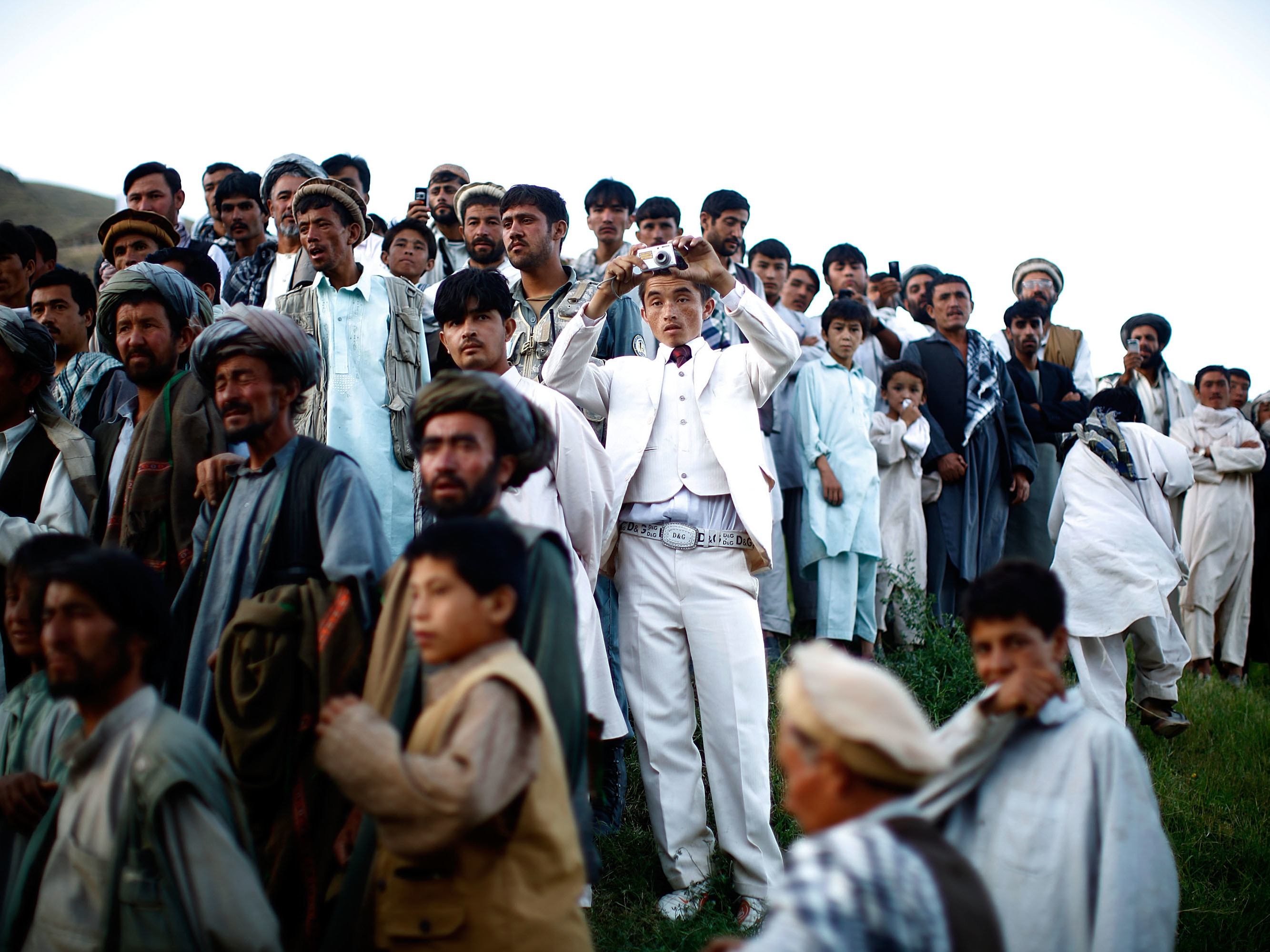 Afghan president Hamid Karzai held a rally in a remote village, where he struck a deal with an influential religious leader. Thousands gathered for the campaign event. From the story &quot;Afghan President Karzai Rallies Support,&quot; 2009. (NPR)