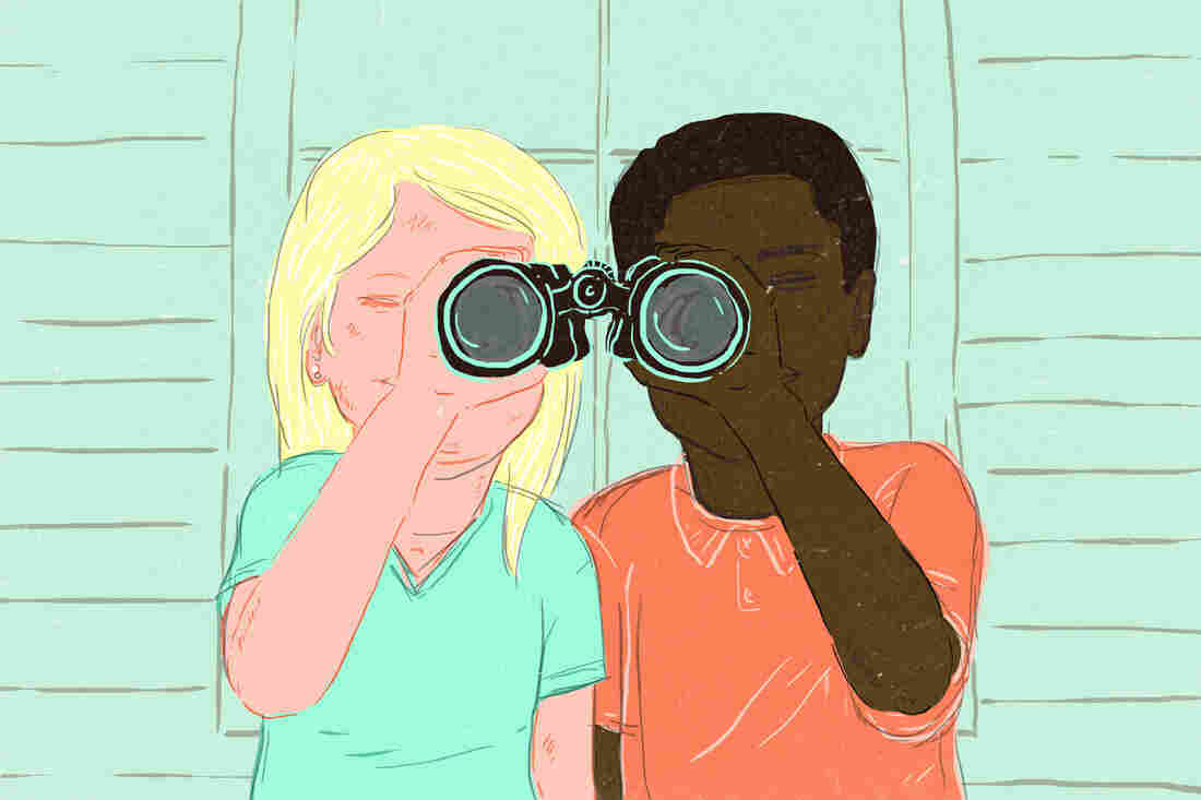 White kid and black kid looking through binoculars together