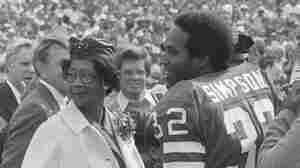 O.J. Simpson with his mother, Eunice, and father, Jimmy Lee, on the field at Rich Stadium for his induction into the Buffalo Bills Wall of Fame in 1980.