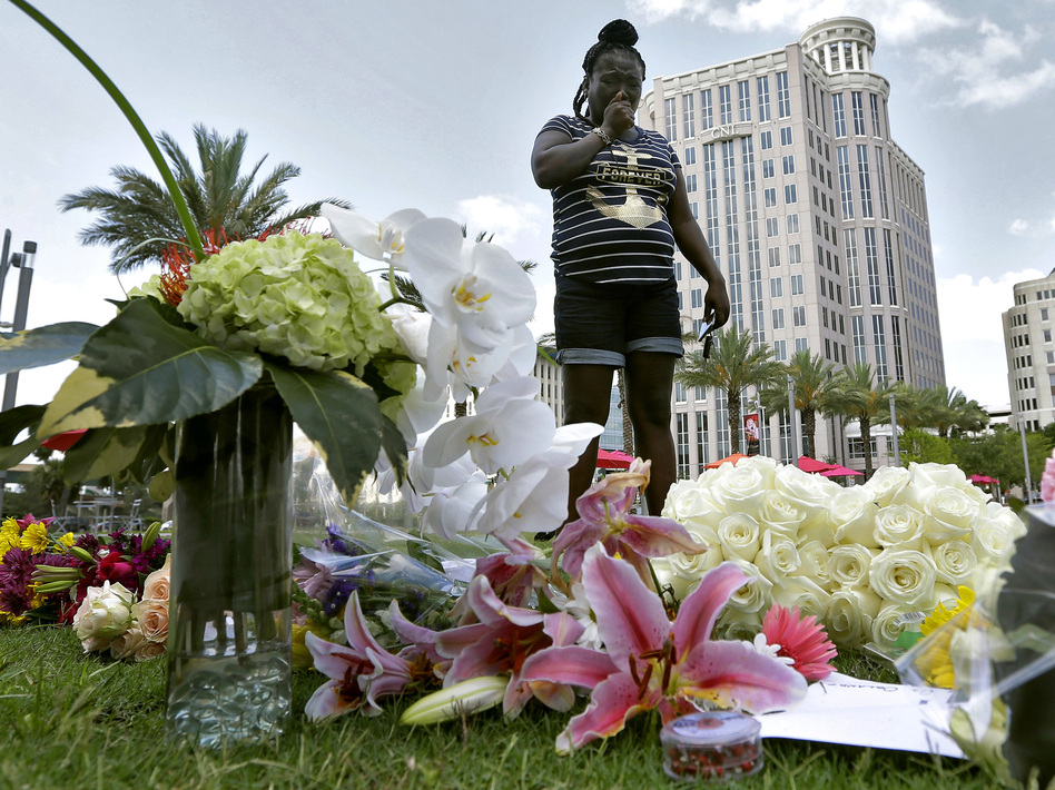 Krystle Martin weeps as she views a memorial Monday for the victims of the fatal shootings at the Pulse Orlando nightclub in Florida. (Chris O'Meara/AP)