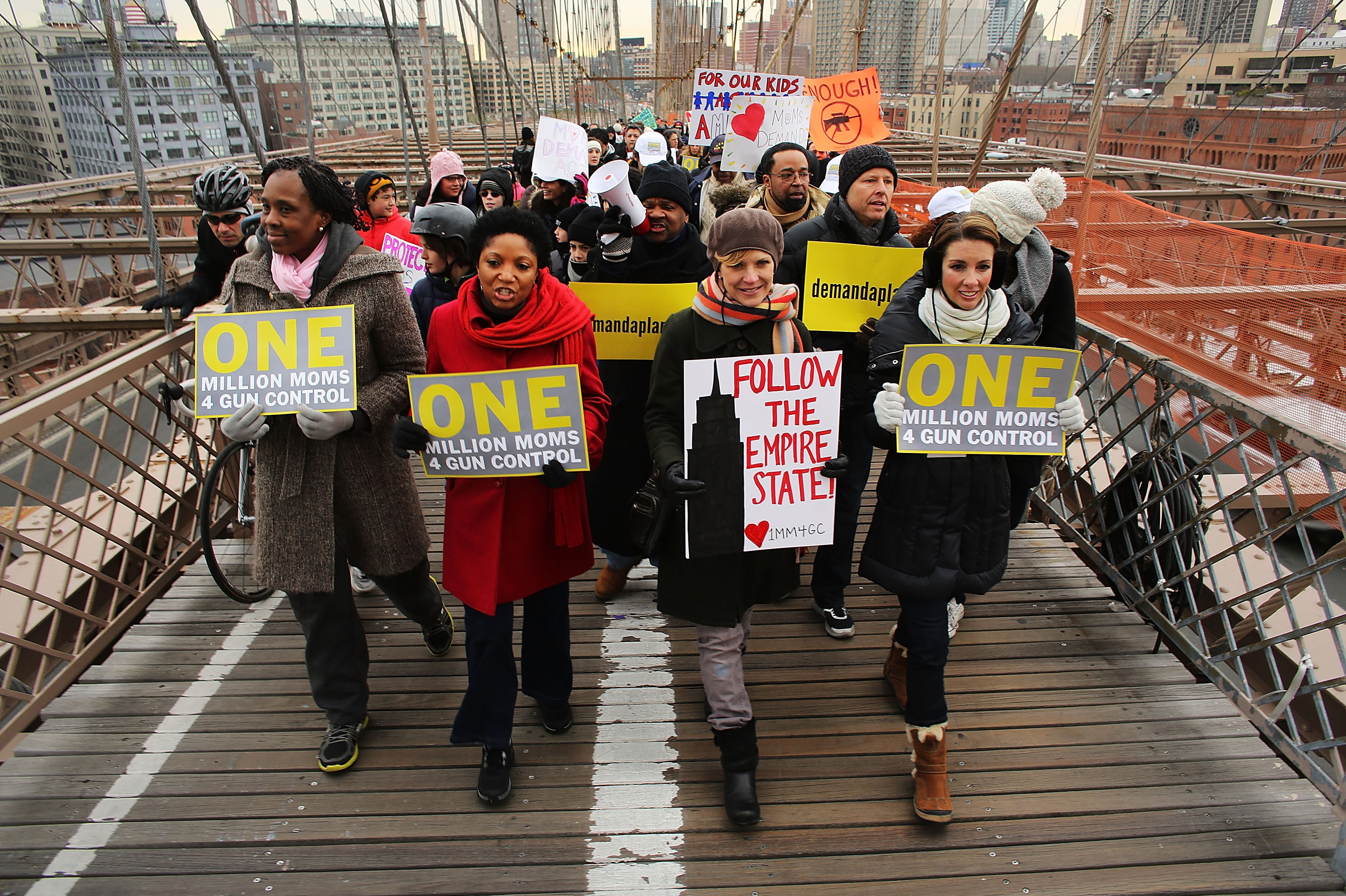 Participants with One Million Moms for Gun Control, a gun control group formed in the wake of the mass shooting at a Newtown, Conn., elementary school, hold a rally and march across the Brooklyn Bridge in New York City in January 2013.