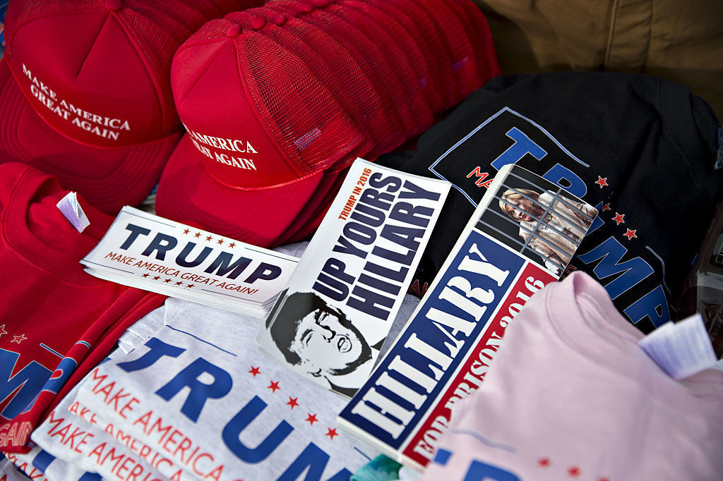 Merchandise supporting Republican presidential candidate Donald Trump sits on a table outside a campaign rally in Muscatine, Iowa, on Jan. 24. (Bloomberg via Getty Images)