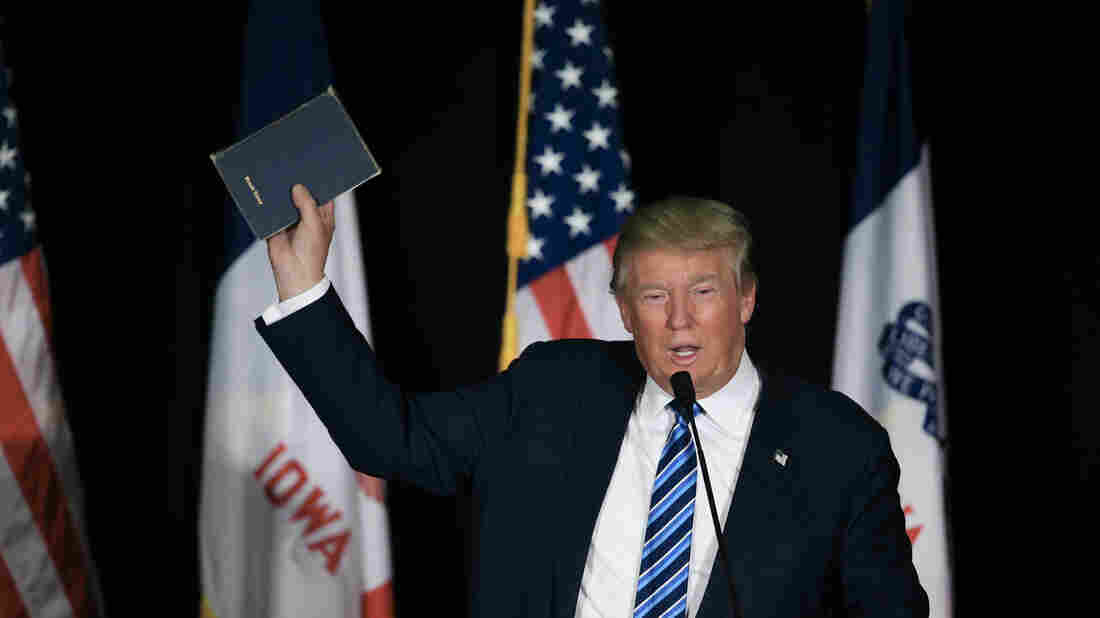 Republican presidential candidate Donald Trump holds up his bible during a campaign stop in Council Bluffs, Iowa last year. Republican presidential candidate Donald Trump holds up his bible during a campaign stop in Council Bluffs, Iowa last year.