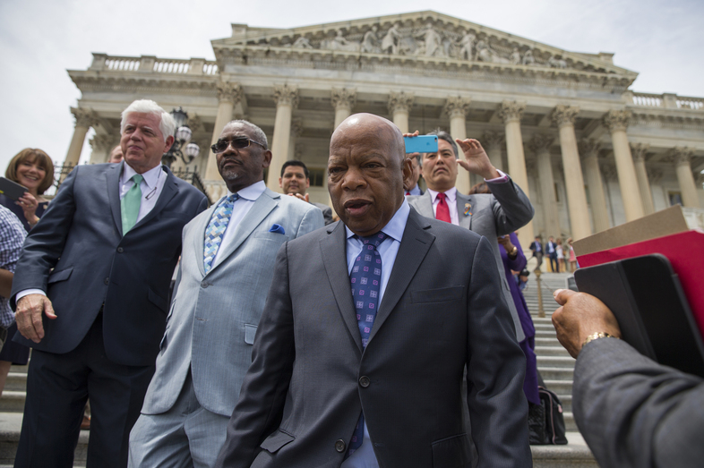 Rep. John Lewis, D-Ga., leads lawmakers down the steps of the Capitol to greet a crowd assembled after House Democrats ended their 26-hour-long sit-in protest on Thursday. (Evan Vucci/AP)