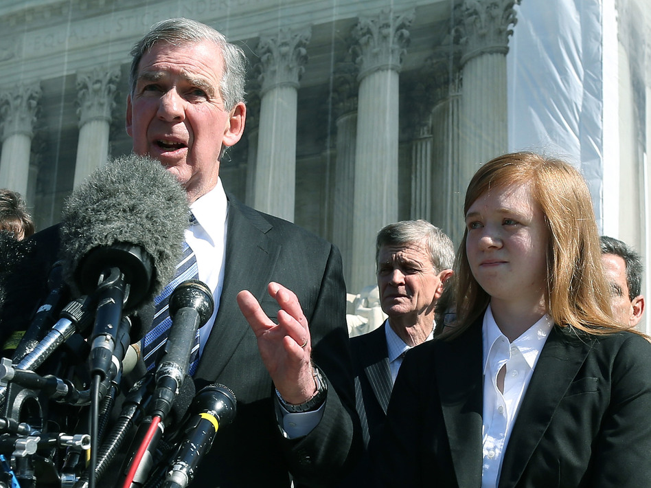 Attorney Bert Rein speaks to the media while standing with plaintiff Abigail Noel Fisher after the U.S. Supreme Court heard arguments in her case in 2012 in Washington, D.C. (Mark Wilson/Getty Images)