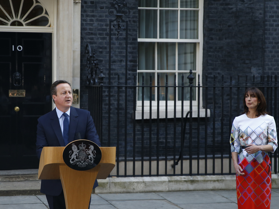 Britain's Prime Minister David Cameron, accompanied by his wife, Samantha, speaks to the media in front of 10 Downing St. on Friday as he announces his resignation following Britain's vote to leave the EU. (Alastair Grant/AP)