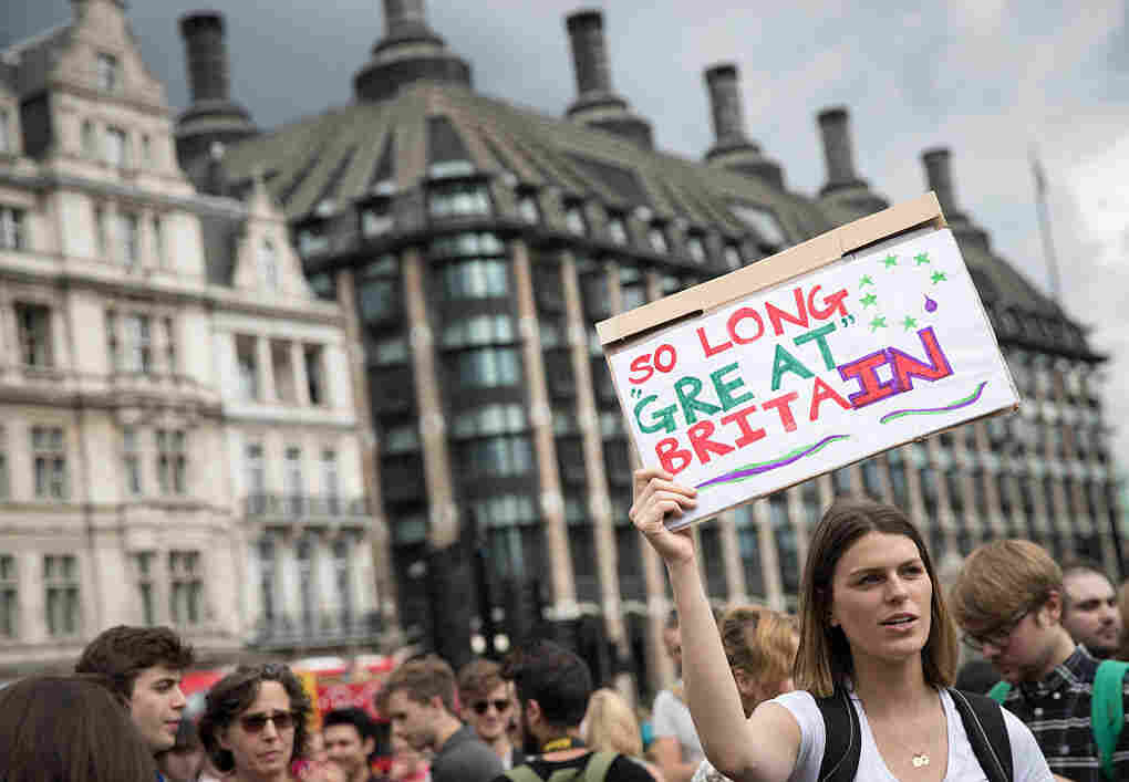 A group of people gather to protest on Parliament Square the day after the majority of the British public voted to leave the European Union on in London.
