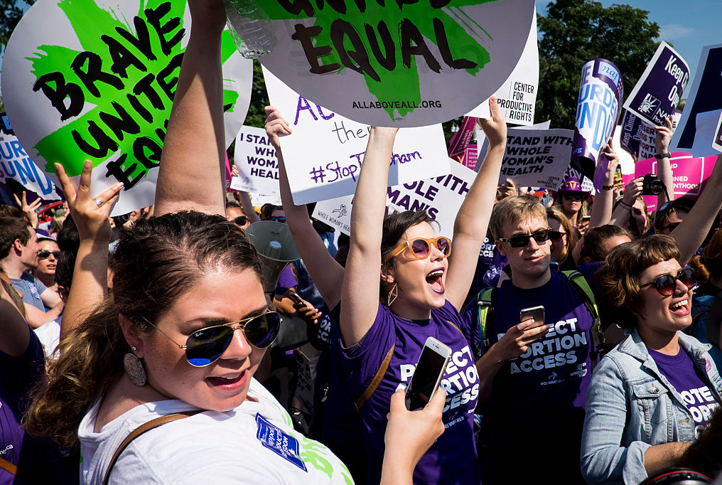 Abortion rights activists celebrate outside the U.S. Supreme Court Monday for a ruling in a case over a Texas law that places restrictions on abortion clinics. (Getty Images)