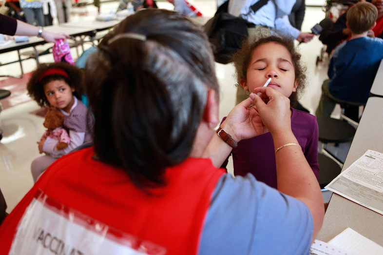 Back in 2009, Ella Curry, 6, received a spritz of FluMist at Northwood High School in Silver Spring, Md. (Jacquelyn Martin/AP)