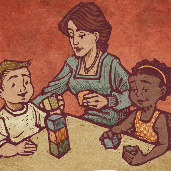 A teacher and two students play with blocks