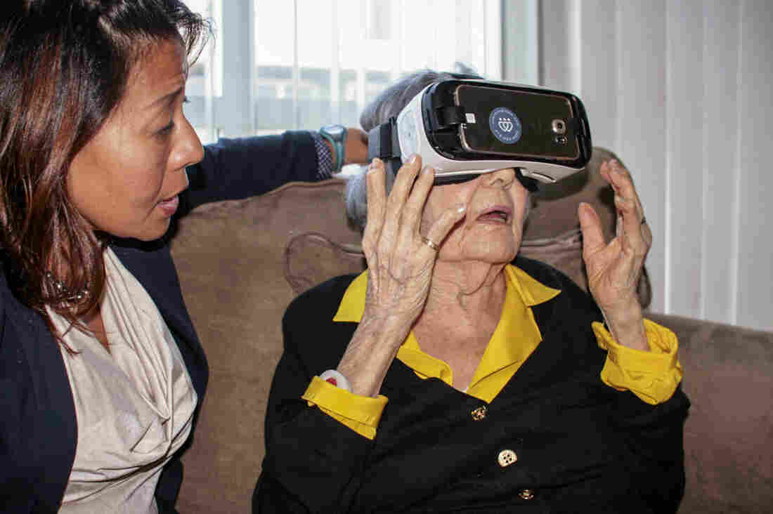 Virginia Anderlini (right) was the first private client to try out Dr. Sonya Kim's new virtual reality program for the elderly, and says she's eager to see more. Kim's handful of programs are still at the demo stage.