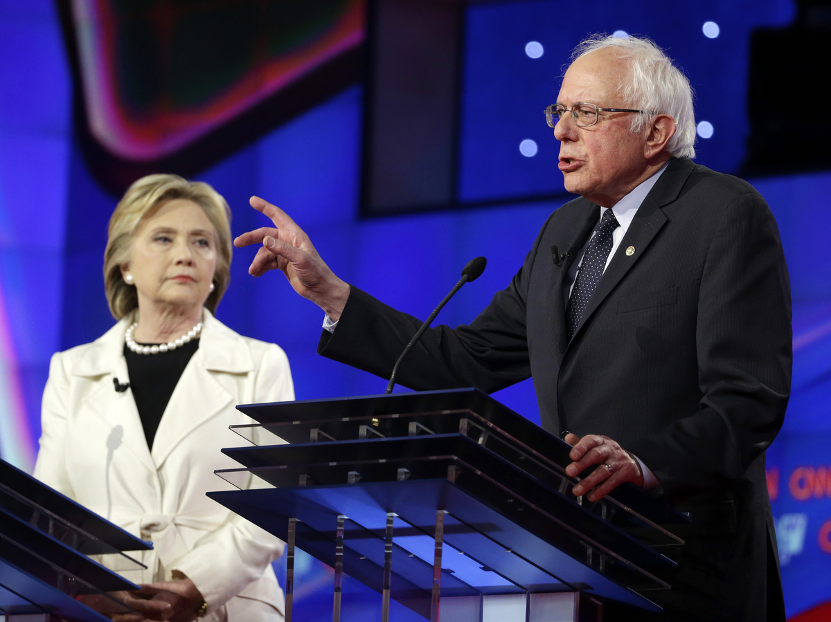 Sen. Bernie Sanders, I-V.t, right, speaks as Hillary Clinton looks on during an April Democratic debate in New York.