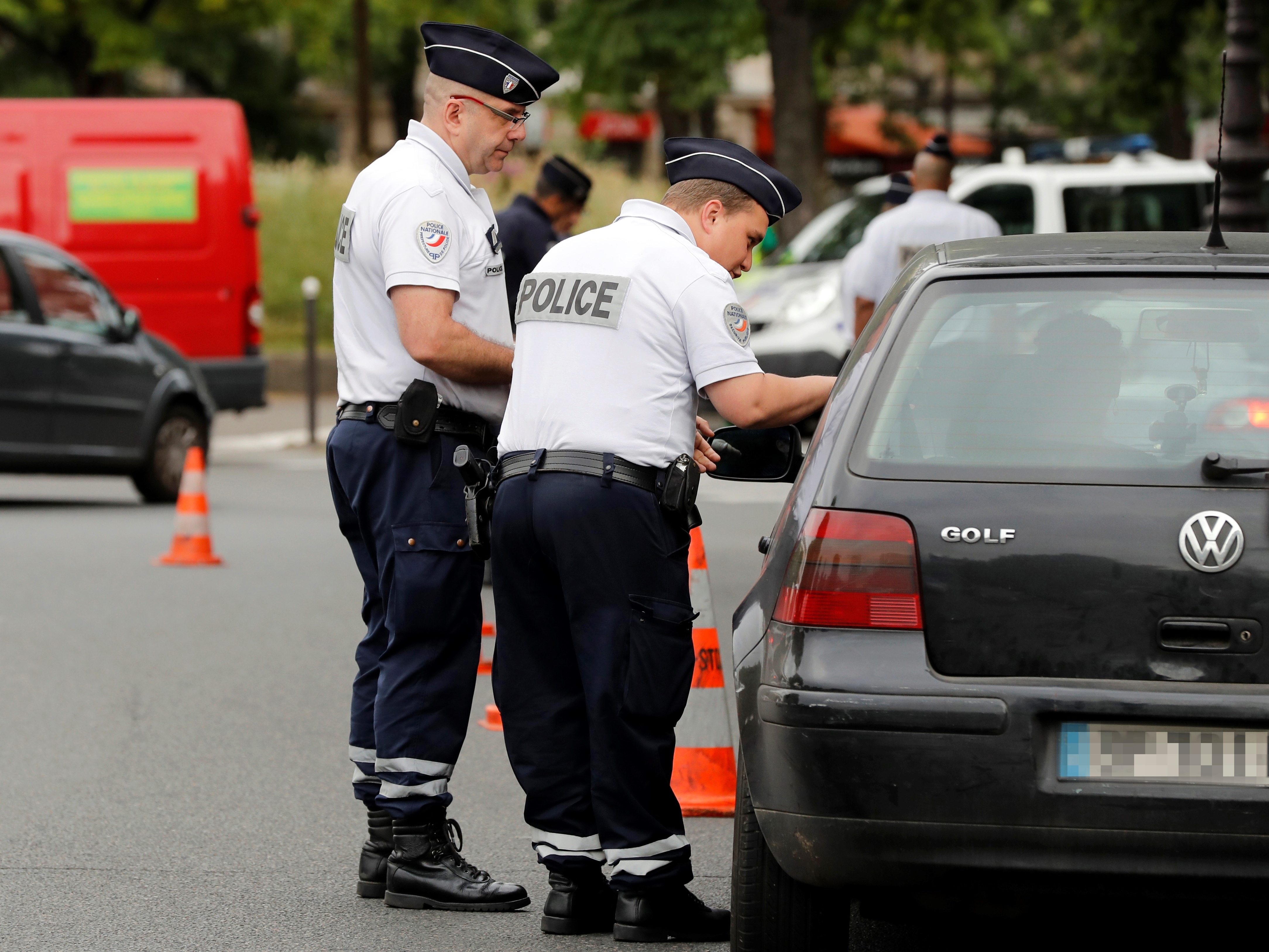 Police patrol traffic in Paris as part of new anti-pollution measures aimed at punishing vehicles registered before 1997 that are forbidden to be driven during the week. Nearly 30 police officers stood guard on the morning of July 1, in the main squares of Paris to control and raise awareness among the drivers about the new measures. (AFP/Getty Images)