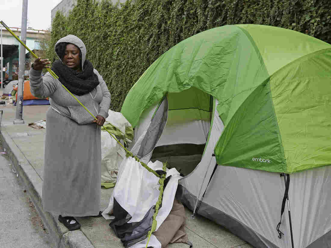 Angela Flax packs up her tent in San Francisco in February. Media outlets in San Francisco saturated Internet, broadcast and print publications this week with news stories about the city's homeless. Angela Flax packs up her tent in San Francisco in February. Media outlets in San Francisco saturated Internet, broadcast and print publications this week with news stories about the city's homeless.