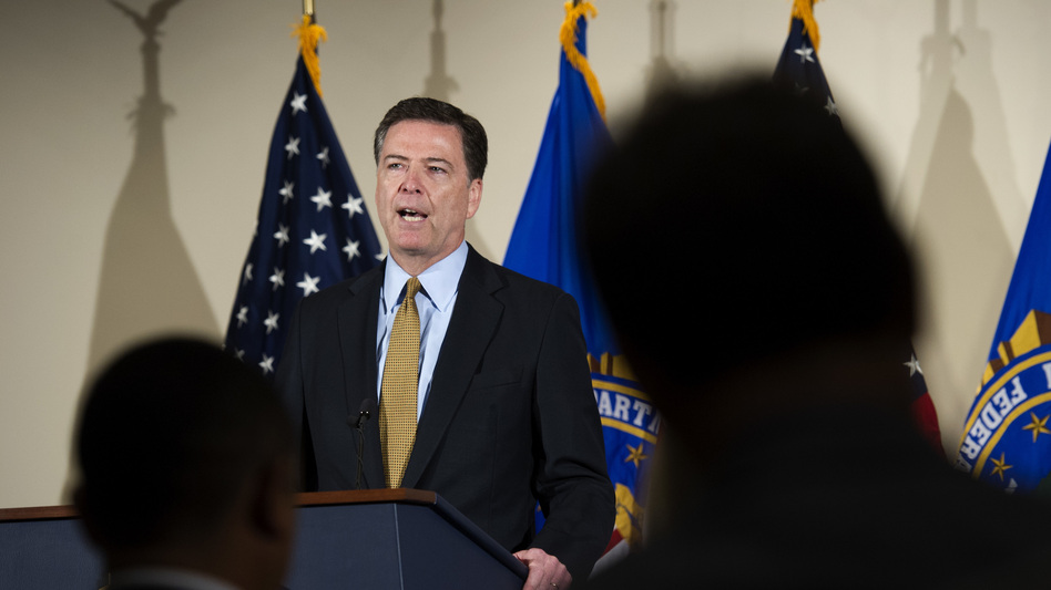 FBI Director James Comey makes a statement at FBI headquarters in Washington, D.C., on Tuesday. Comey said 110 emails sent or received on Hillary Clinton's server contained classified information. (Cliff Owen/AP)