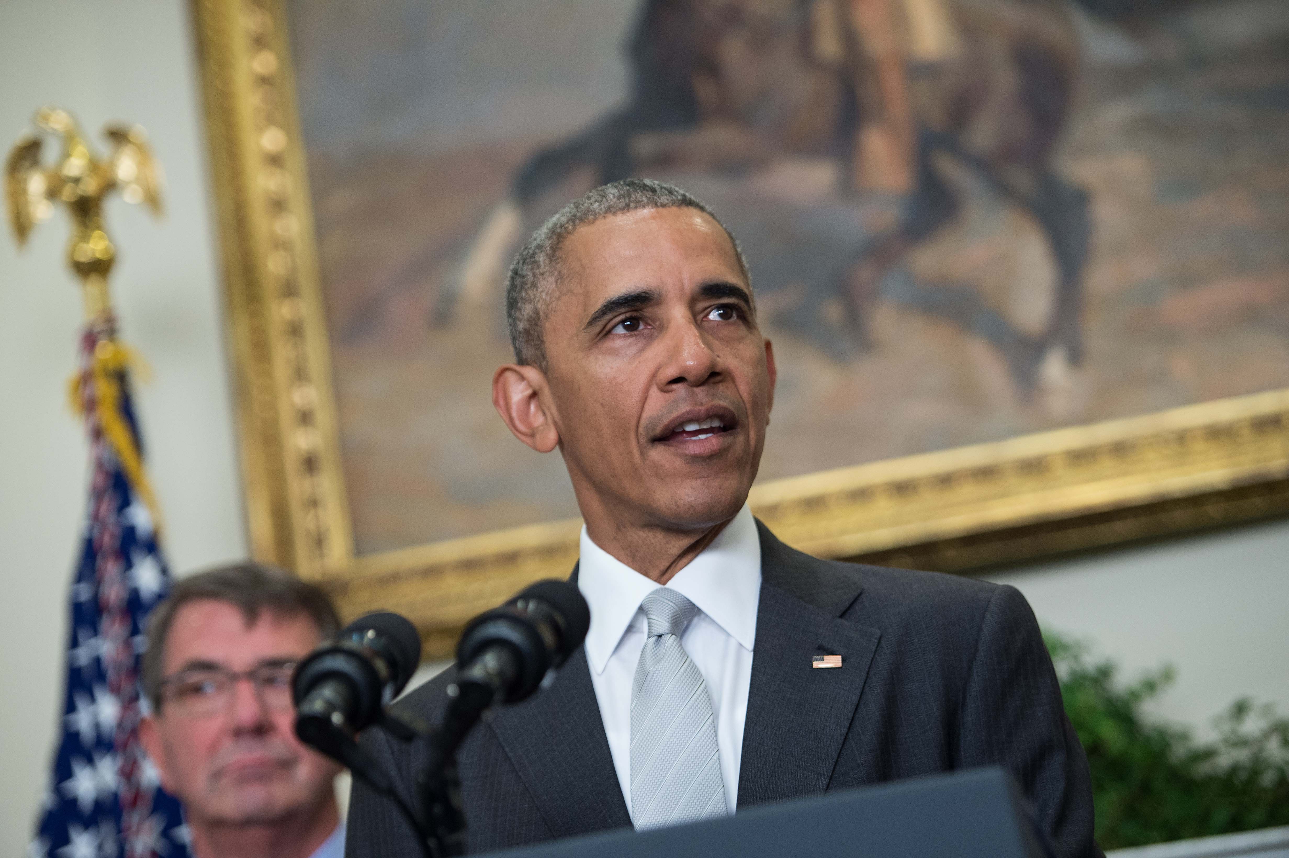 President Obama announces that 8,400 U.S. troops will remain in Afghanistan into 2017. At left is Defense Secretary Ashton Carter. (AFP/Getty Images)